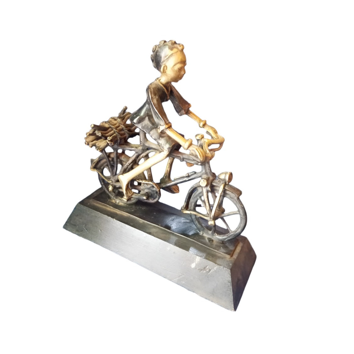 Metal Sculpture Depicts a Child On a Bicycle